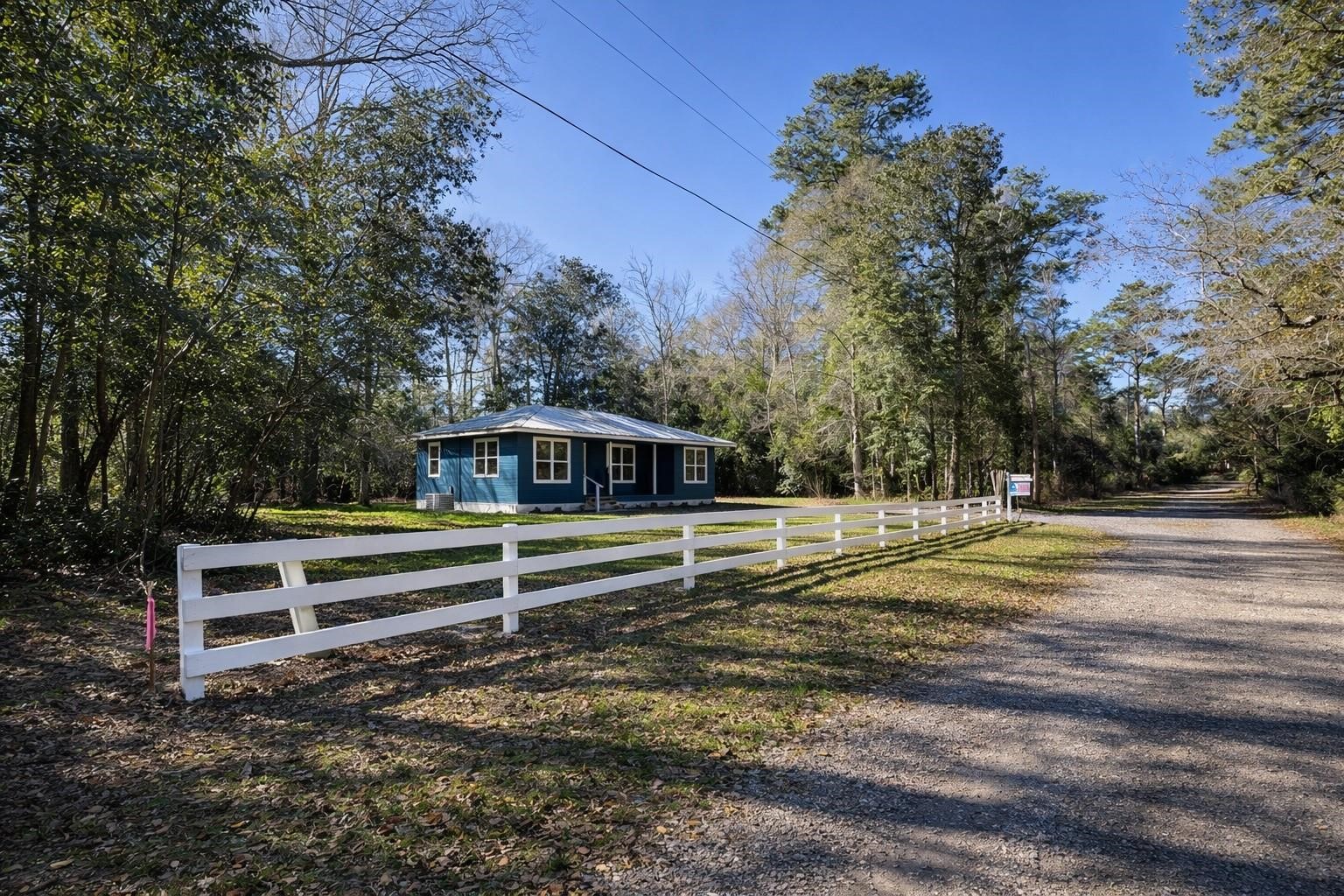 180 Friar Tuck Drive Ivanhoe, TX 75979 - Photo 2 of 31 a view of a yard with a bench