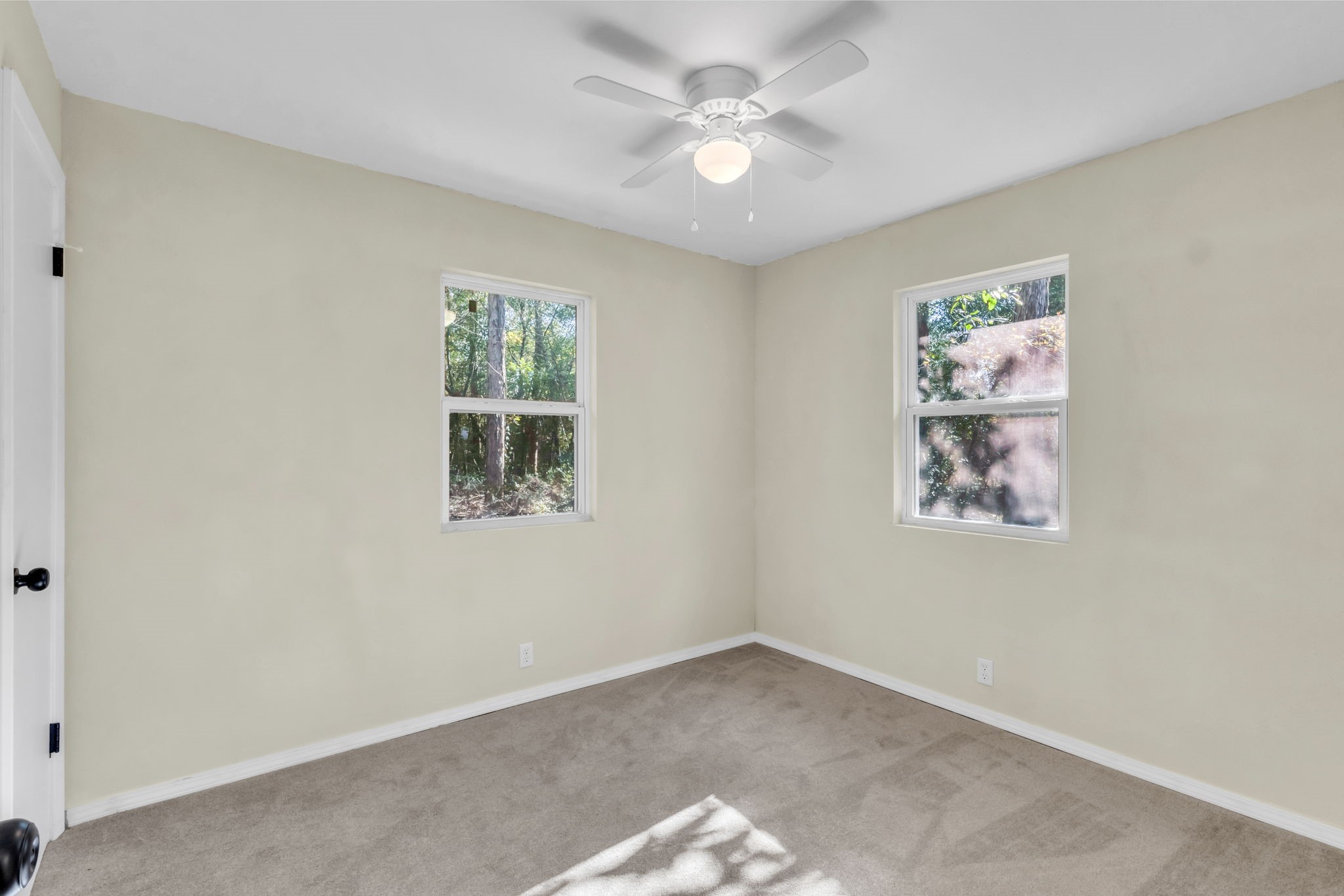 180 Friar Tuck Drive Ivanhoe, TX 75979 - Photo 25 of 31 an empty room with windows and fan