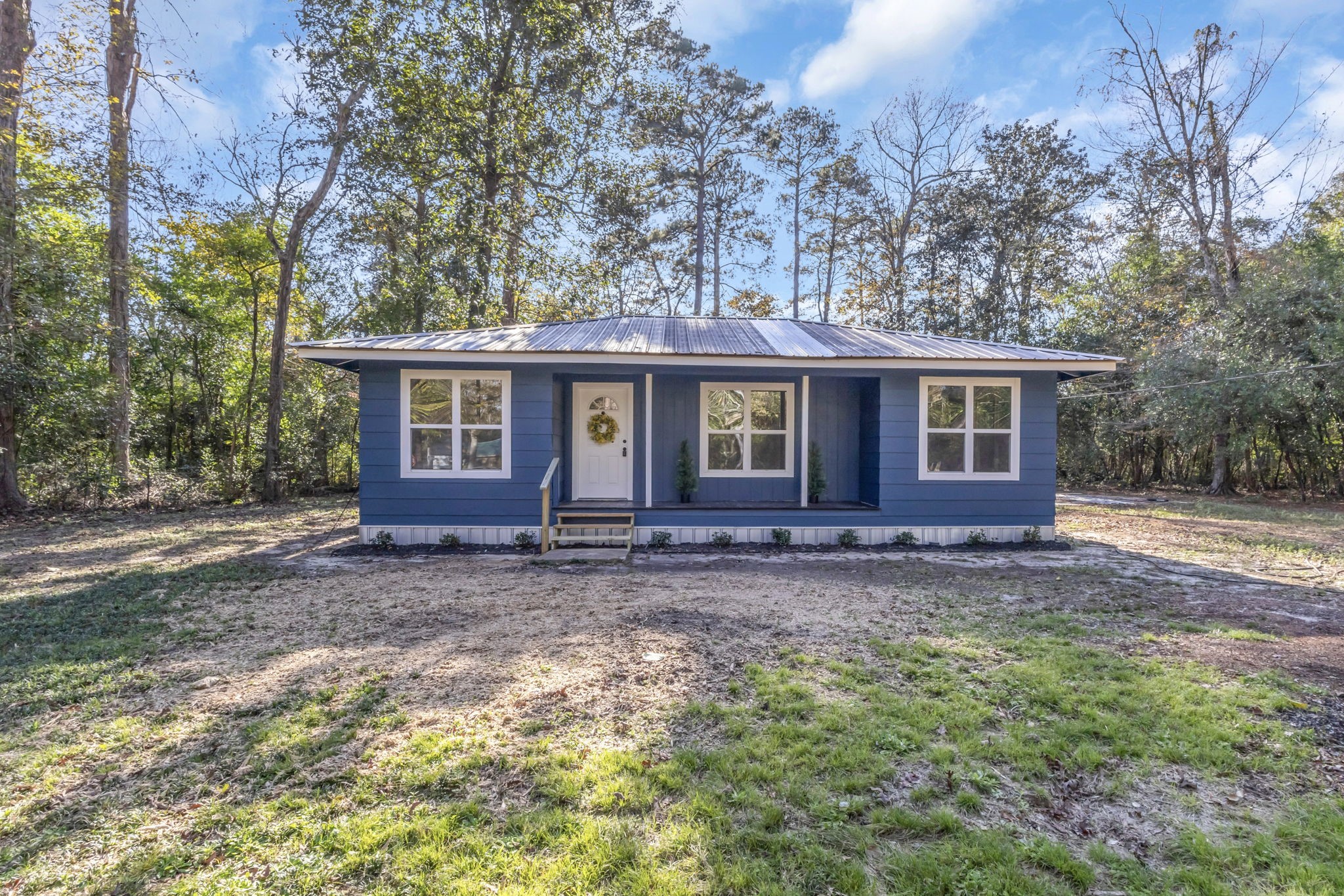 180 Friar Tuck Drive Ivanhoe, TX 75979 - Photo 4 of 31 a view of a house with a yard