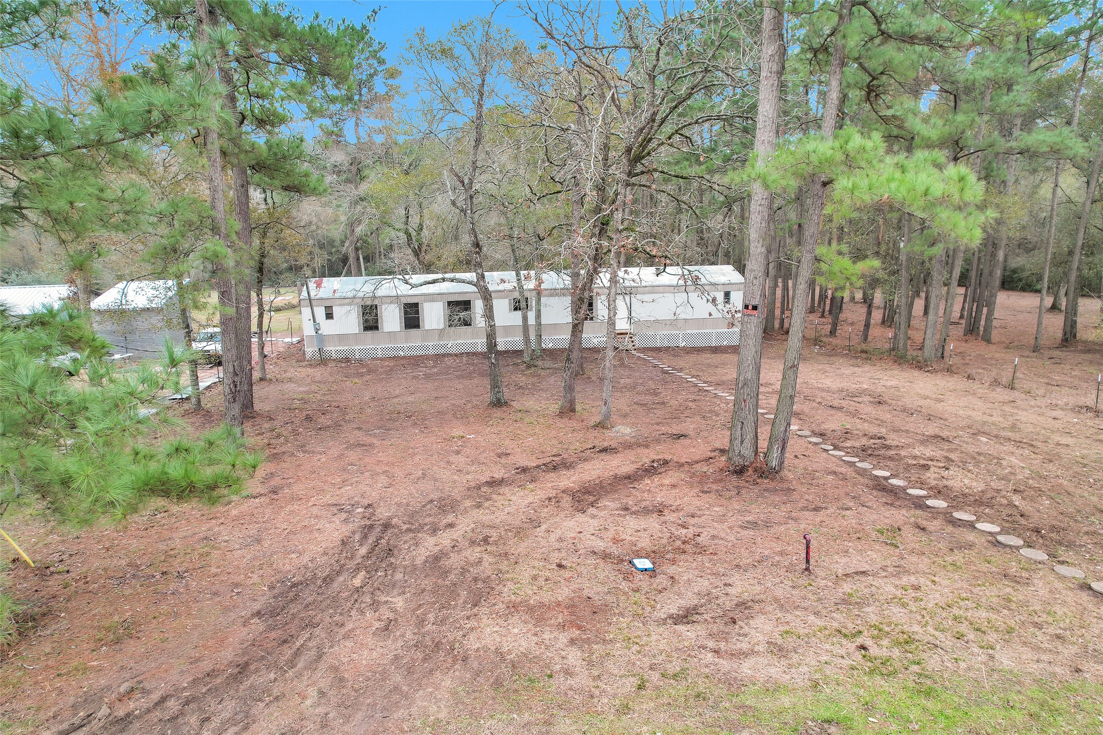 Split A Tall Pine Road Navasota, TX 77868 - Photo 11 of 22 a backyard of a house with table and chairs