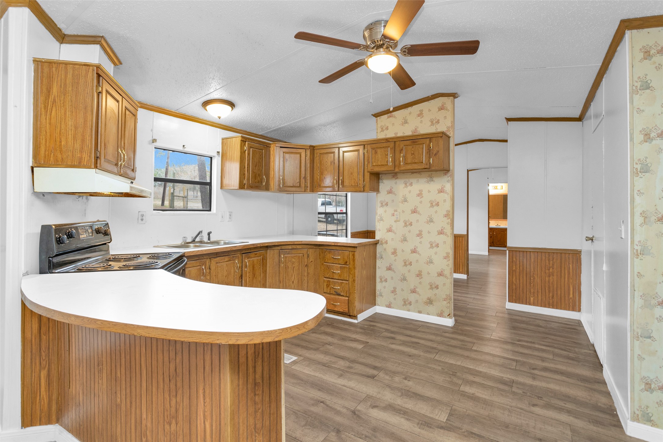 Split A Tall Pine Road Navasota, TX 77868 - Photo 14 of 22 a kitchen with stainless steel appliances granite countertop a sink a stove and a refrigerator
