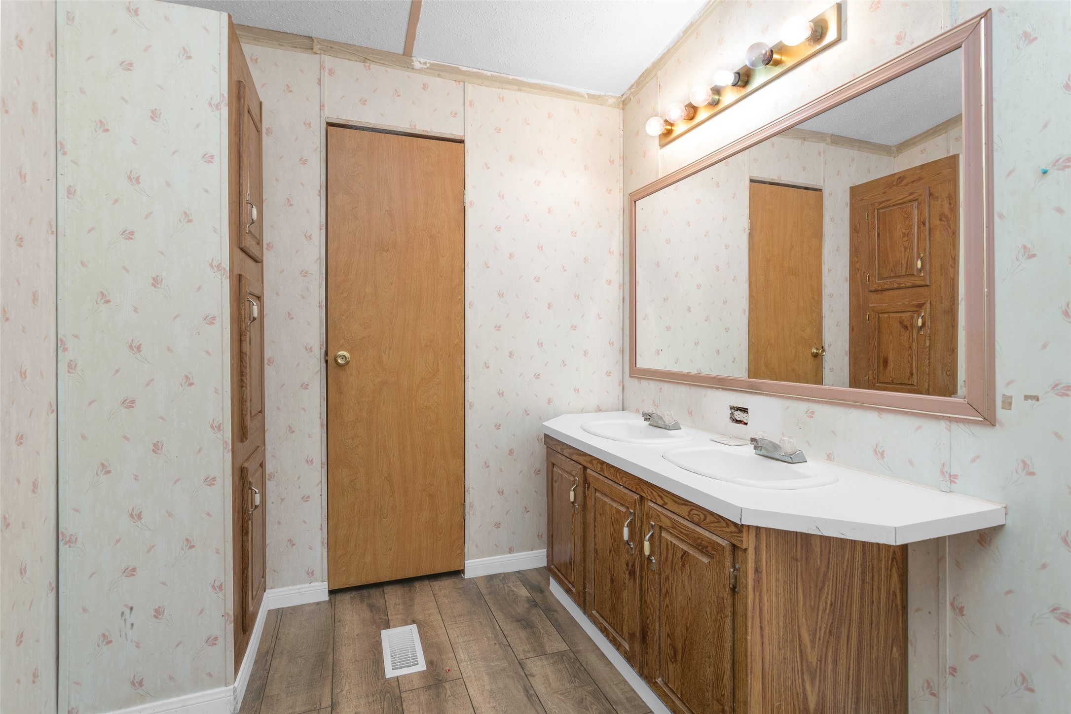 Split A Tall Pine Road Navasota, TX 77868 - Photo 18 of 22 a bathroom with a sink a mirror and a shower