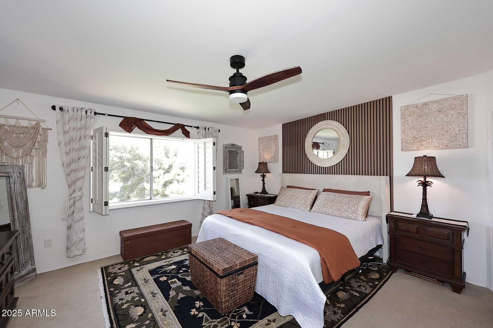 7860 East Camelback Road, Unit 404 Scottsdale, AZ 85251 - Photo 23 of 33 a bed room with a bed and a chandelier