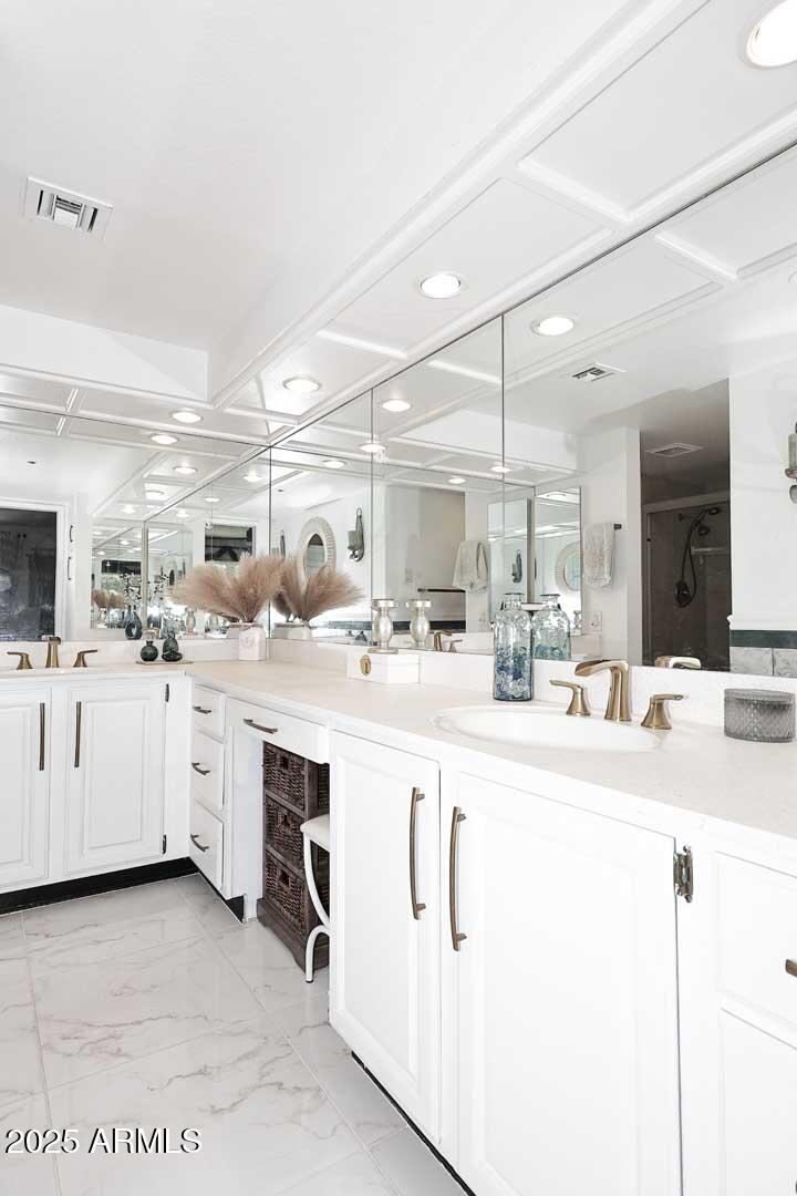 7860 East Camelback Road, Unit 404 Scottsdale, AZ 85251 - Photo 24 of 33 a kitchen with white cabinets