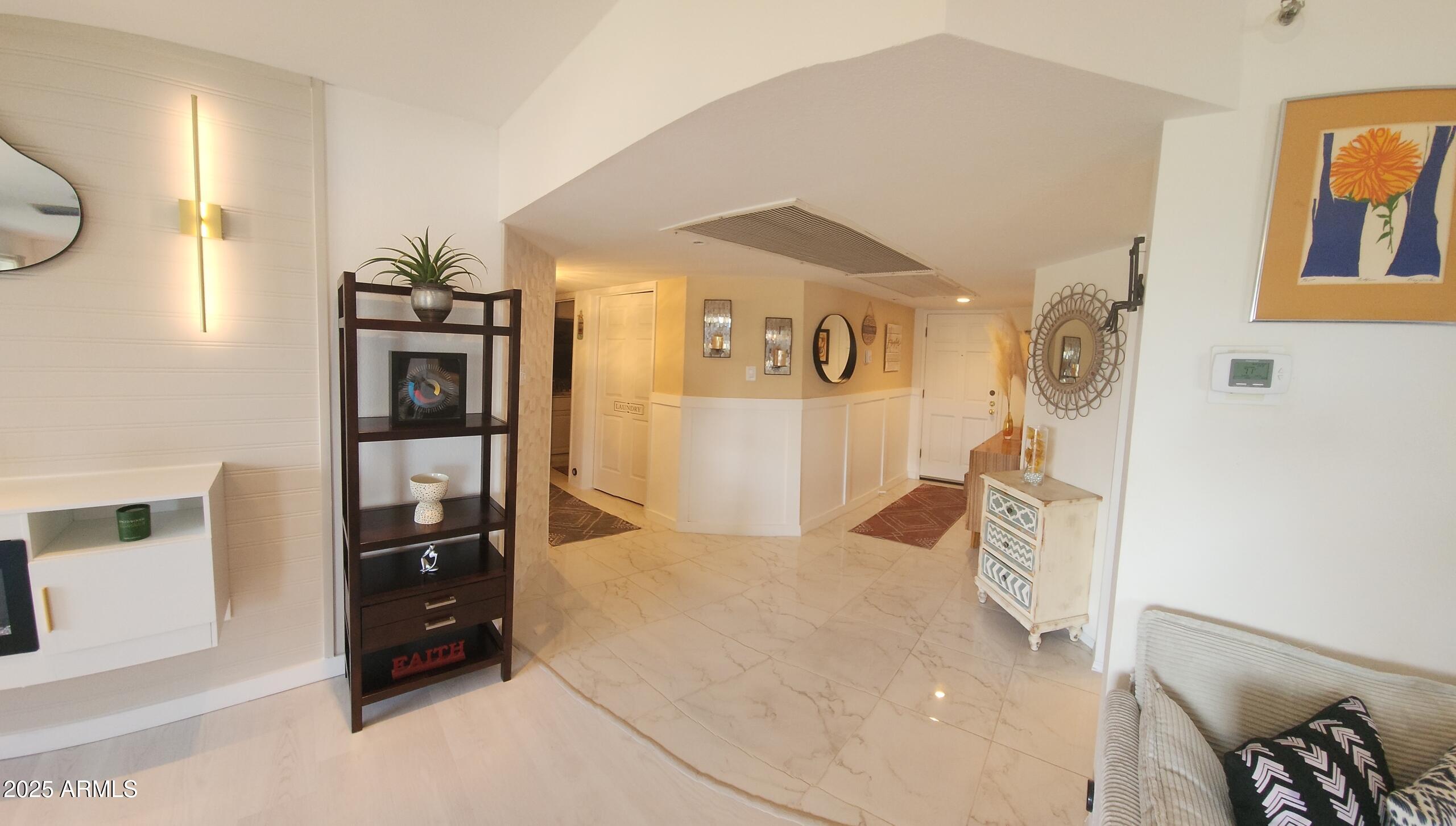 7860 East Camelback Road, Unit 404 Scottsdale, AZ 85251 - Photo 3 of 33 a bedroom with a bed and a cabinets