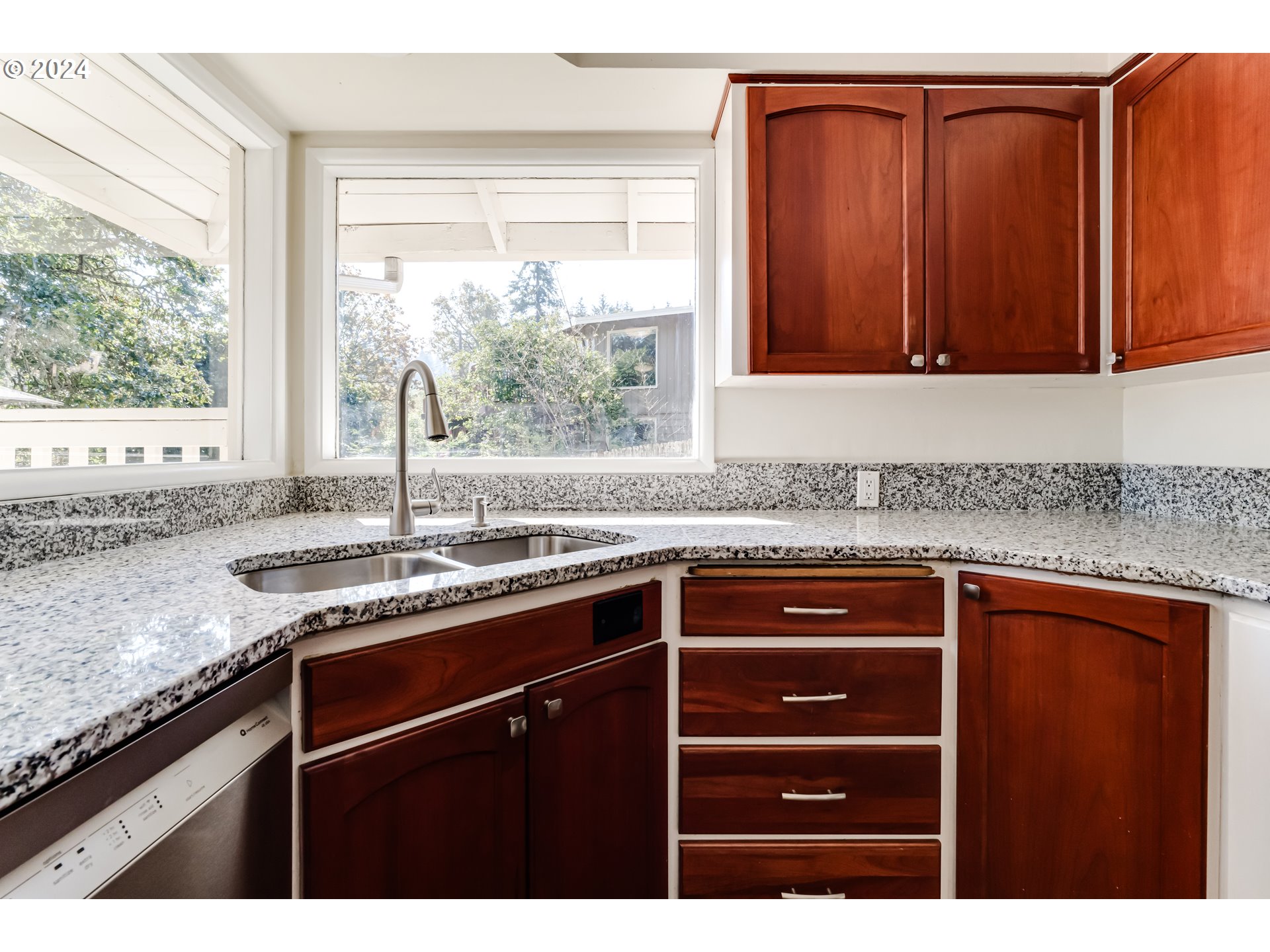 2280 City View Street Eugene, OR 97405 - Photo 11 of 30 a kitchen with granite countertop cabinets sink and window