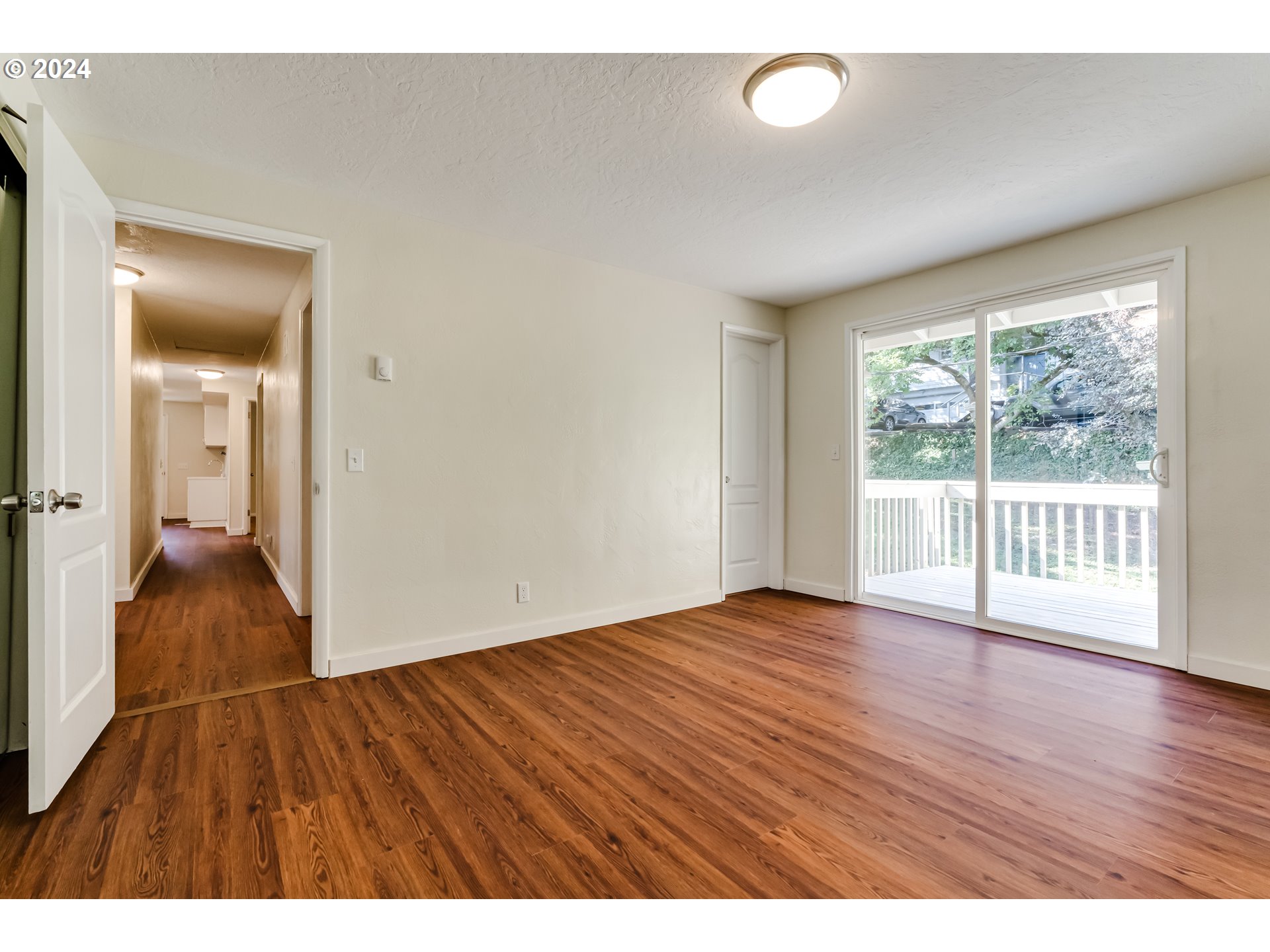 2280 City View Street Eugene, OR 97405 - Photo 17 of 30 wooden floor in an empty room with a window
