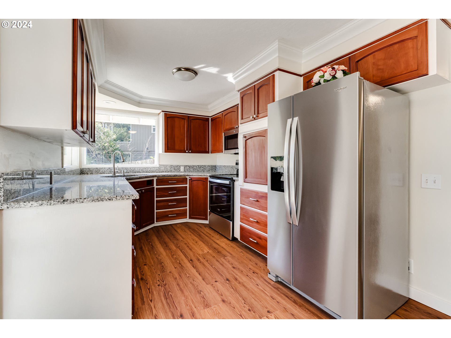 2280 City View Street Eugene, OR 97405 - Photo 9 of 30 a kitchen with stainless steel appliances a refrigerator and a stove top oven