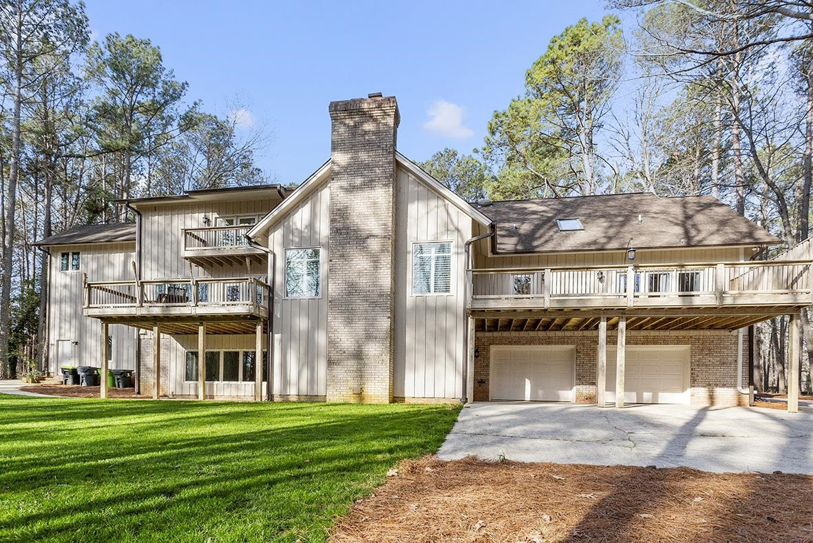 8120 Hawkshead Road Wake Forest, NC 27587 - Photo 13 of 70 a front view of a building with a garden