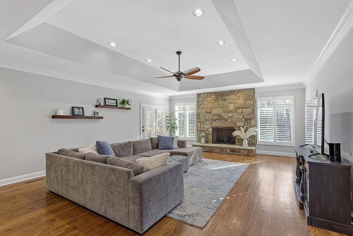 8120 Hawkshead Road Wake Forest, NC 27587 - Photo 16 of 70 a living room with furniture fireplace and flat screen tv