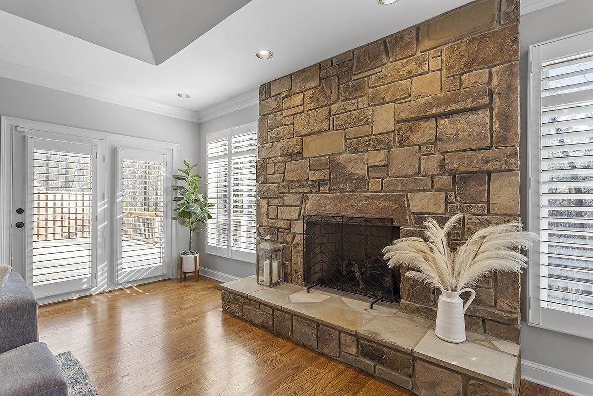 8120 Hawkshead Road Wake Forest, NC 27587 - Photo 18 of 70 a living room with fireplace furniture and a large window