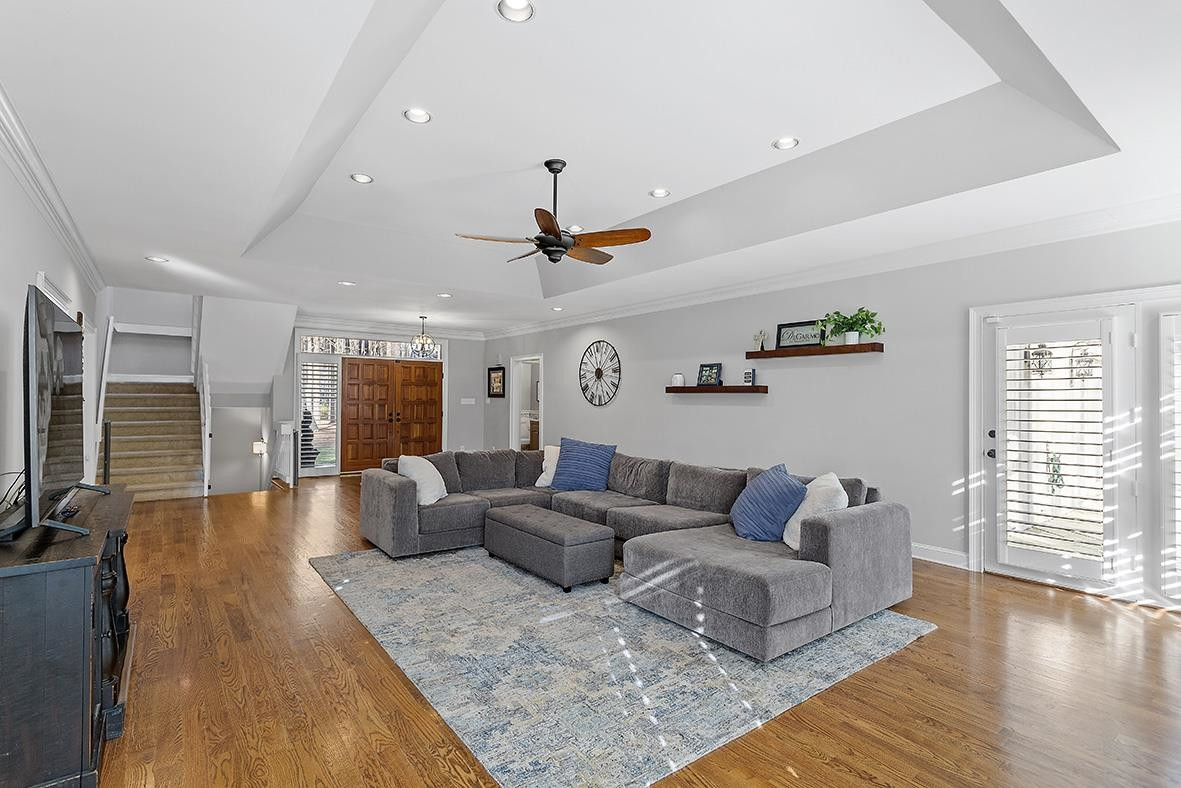 8120 Hawkshead Road Wake Forest, NC 27587 - Photo 19 of 70 a living room with furniture and wooden floor