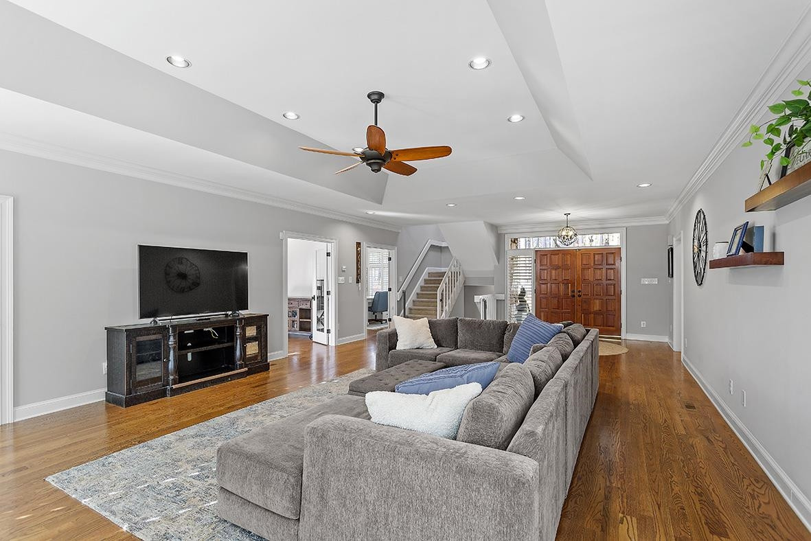 8120 Hawkshead Road Wake Forest, NC 27587 - Photo 20 of 70 a living room with furniture and a flat screen tv