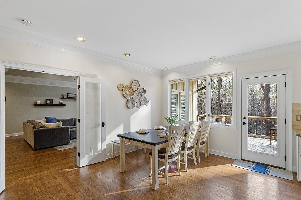 8120 Hawkshead Road Wake Forest, NC 27587 - Photo 21 of 70 a view of a dining room with furniture and wooden floor