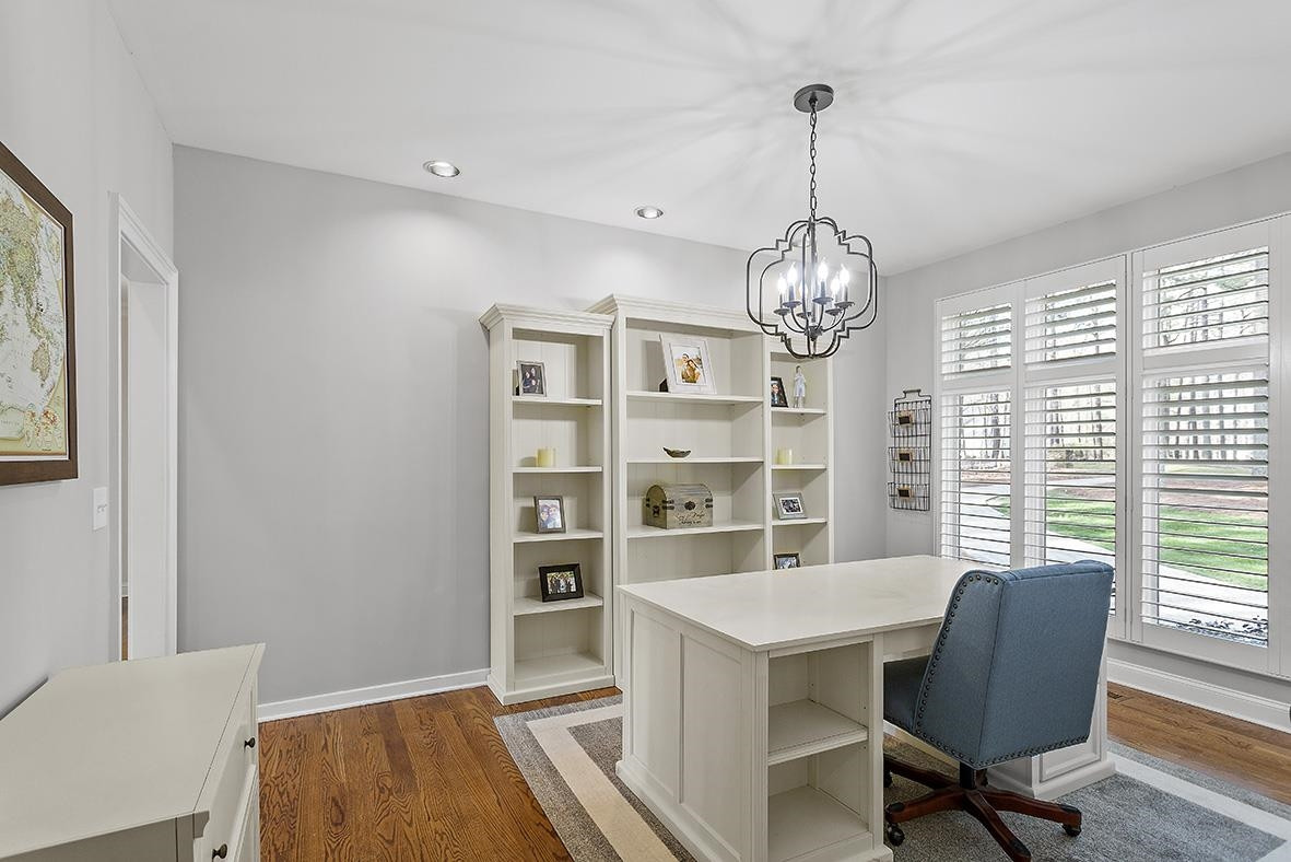 8120 Hawkshead Road Wake Forest, NC 27587 - Photo 36 of 70 a view of a dining room with furniture window and wooden floor