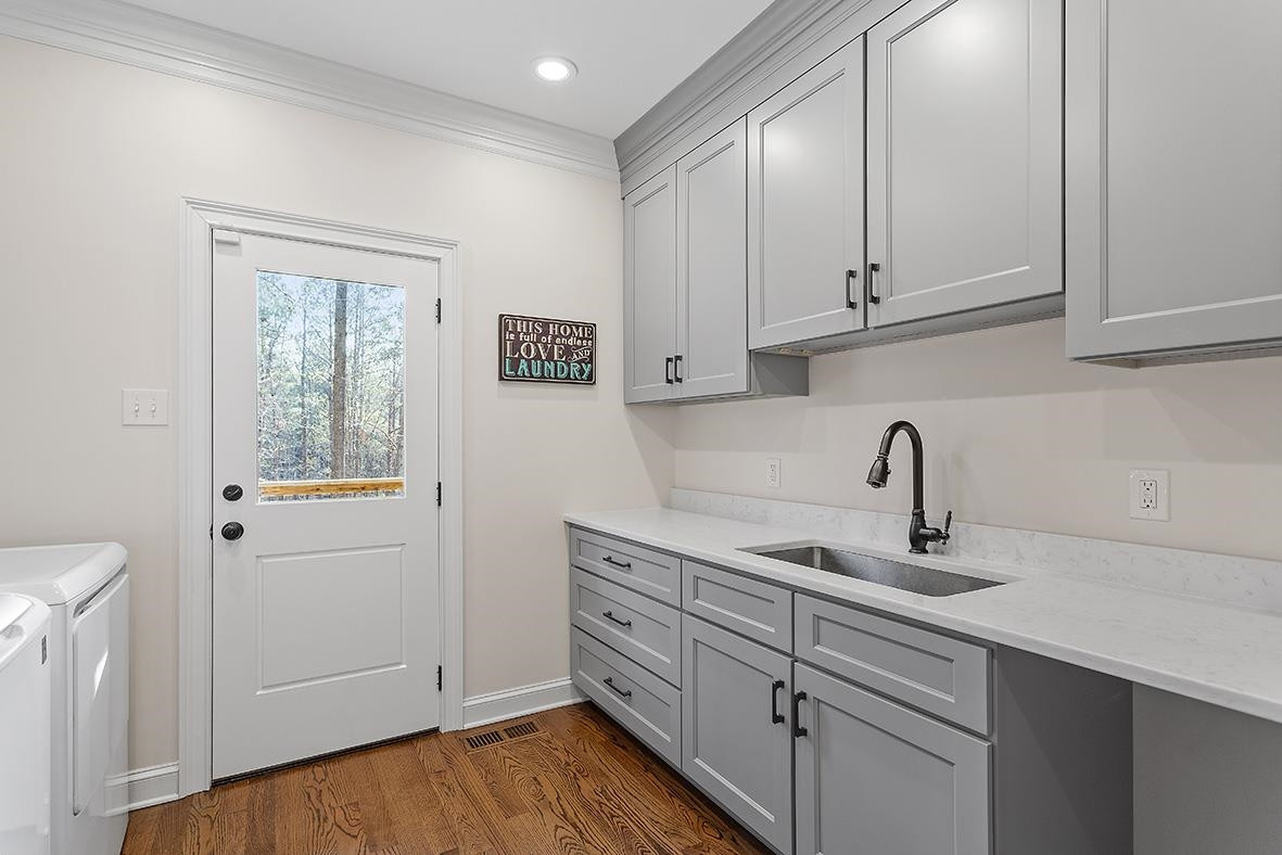 8120 Hawkshead Road Wake Forest, NC 27587 - Photo 38 of 70 a kitchen with cabinets appliances and a sink