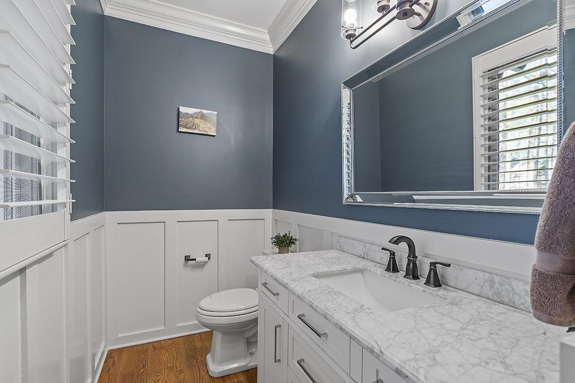 8120 Hawkshead Road Wake Forest, NC 27587 - Photo 39 of 70 a bathroom with a granite countertop toilet sink and mirror