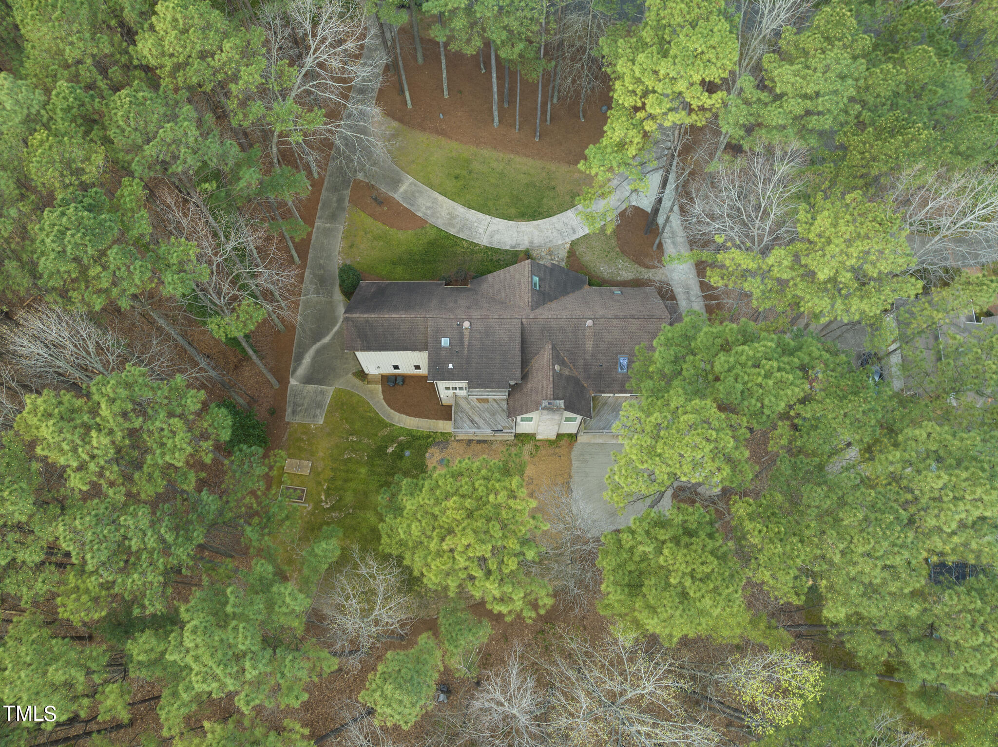8120 Hawkshead Road Wake Forest, NC 27587 - Photo 4 of 70 an aerial view of a house with a yard and large trees