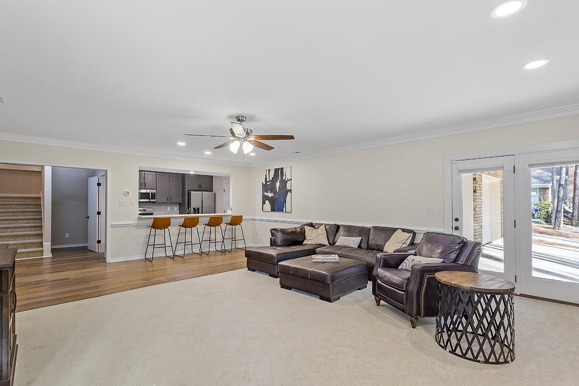 8120 Hawkshead Road Wake Forest, NC 27587 - Photo 41 of 70 a living room with furniture and a flat screen tv