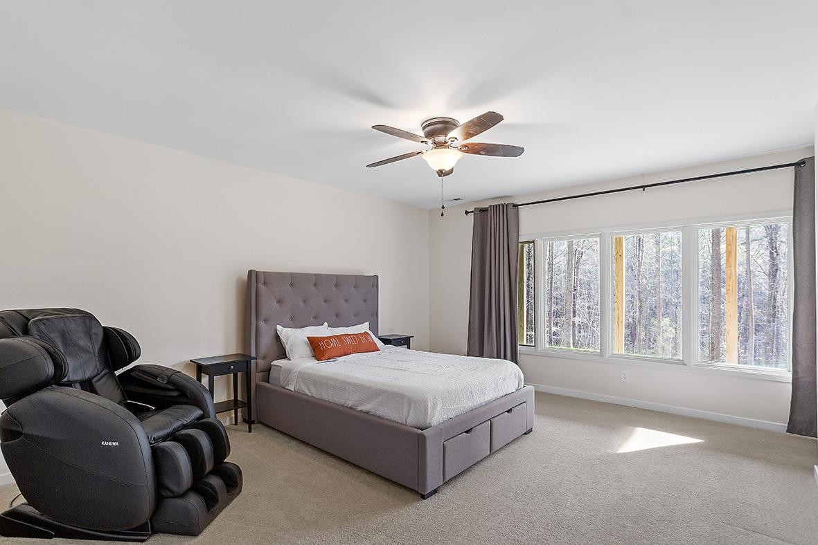 8120 Hawkshead Road Wake Forest, NC 27587 - Photo 46 of 70 a bedroom with a bed couch and window
