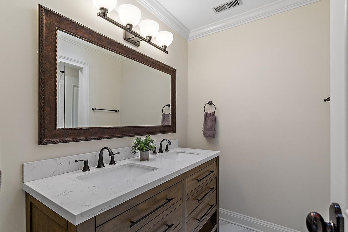 8120 Hawkshead Road Wake Forest, NC 27587 - Photo 51 of 70 a bathroom with a sink and a mirror