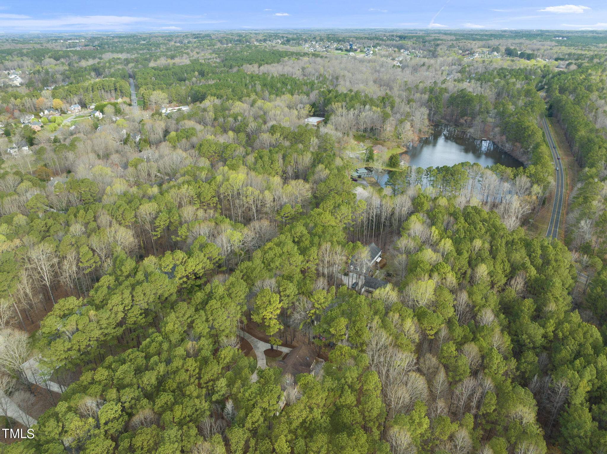 8120 Hawkshead Road Wake Forest, NC 27587 - Photo 63 of 70 a view of a field with a lush green forest
