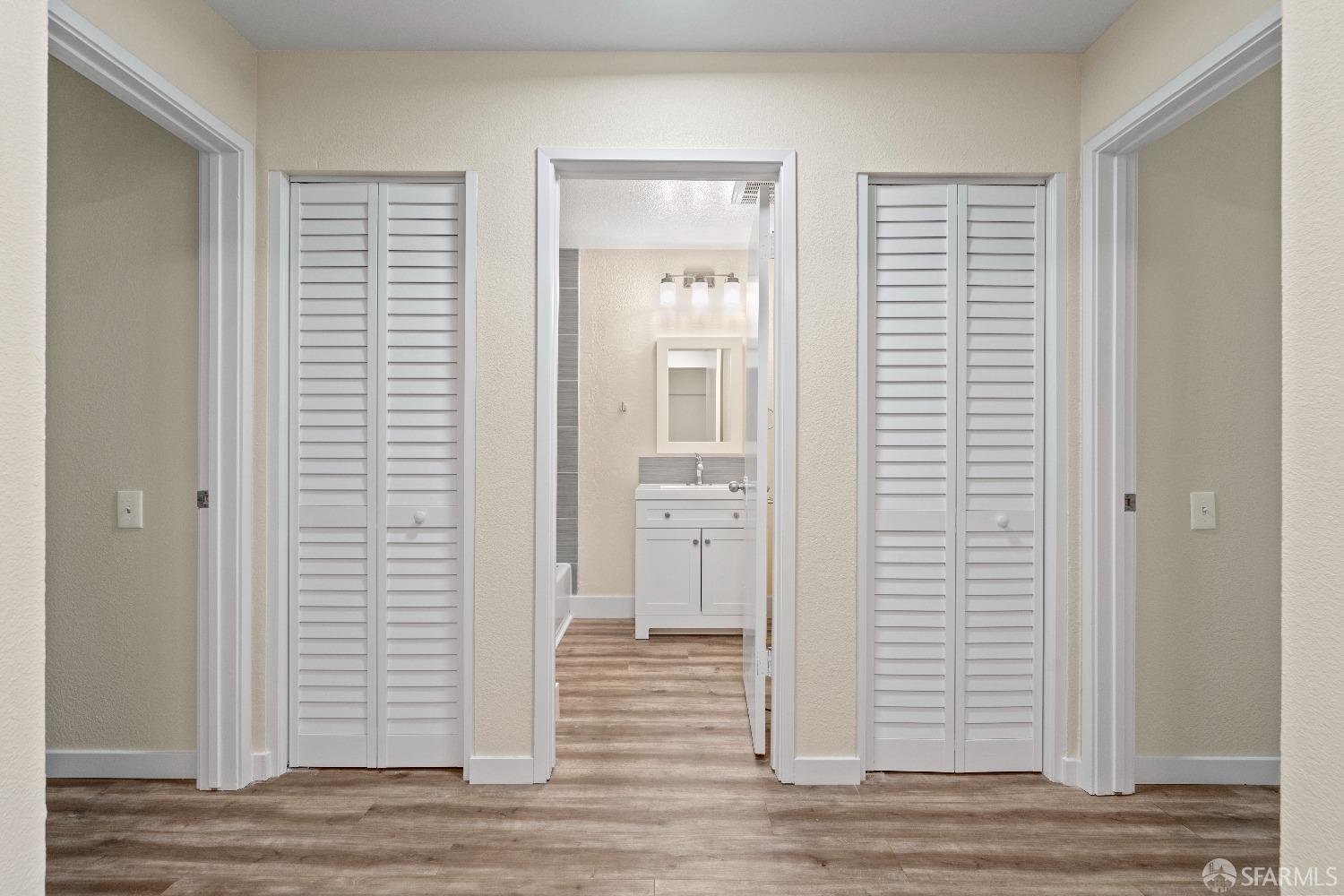 1862 Ellis Street, Unit B San Francisco, CA 94115 - Photo 41 of 41 an empty room with wooden floor and windows