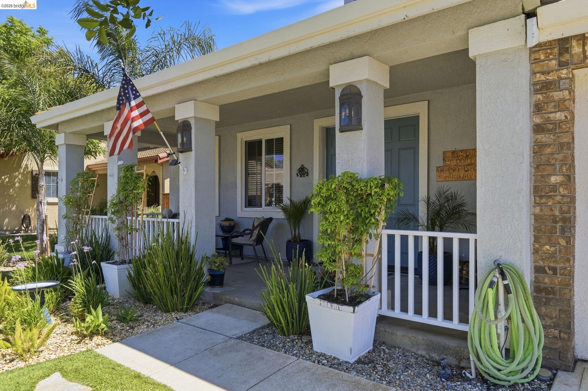 3438 Keystone Loop Discovery Bay, CA 94505 - Photo 5 of 57 a view of a house with a small yard and plants