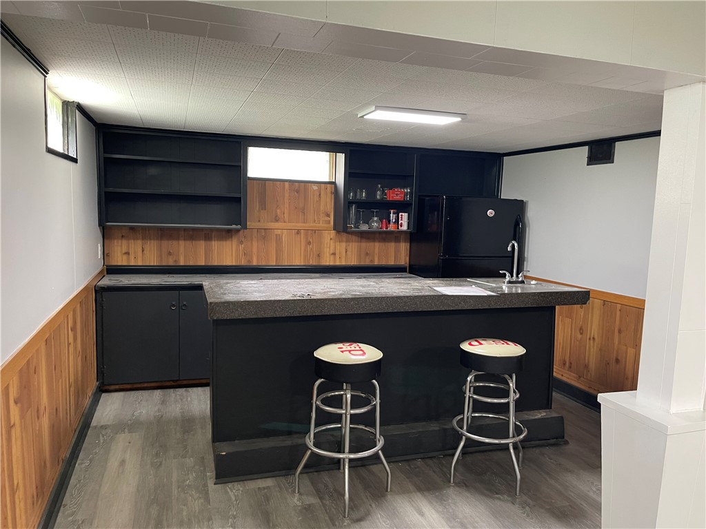 1361 Sussex Road Troy, OH 45373 - Photo 22 of 25 This versatile basement space features a fully equipped wet bar for entertaining.
