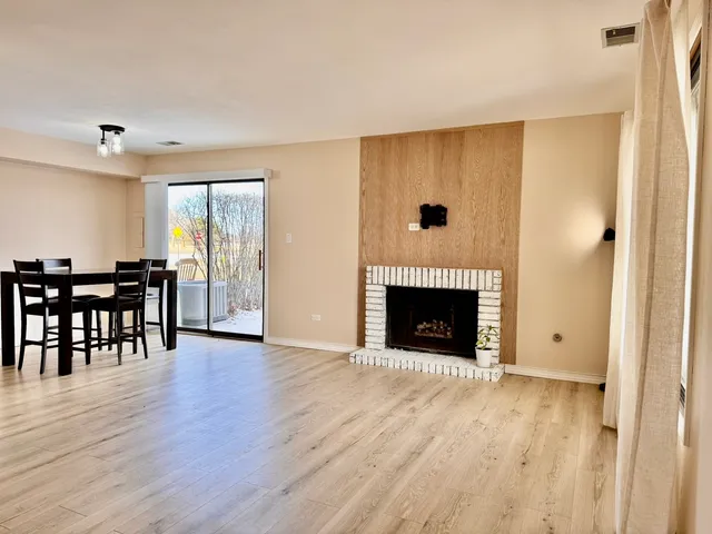 a view of a livingroom with furniture and a fireplace