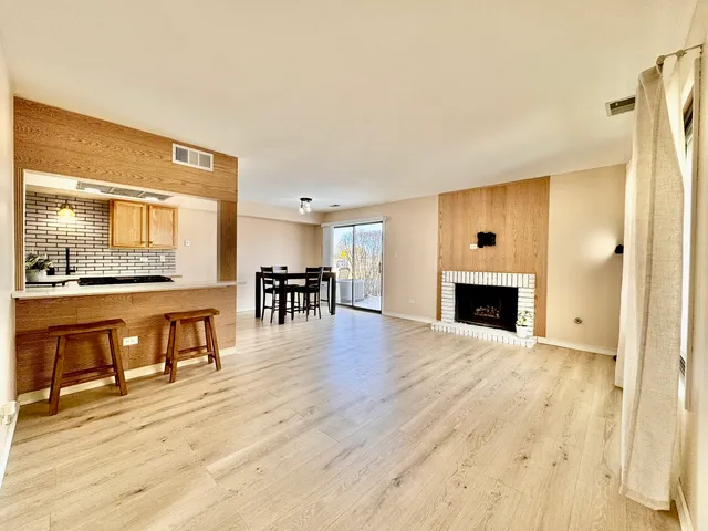 a view of kitchen with furniture and wooden floor