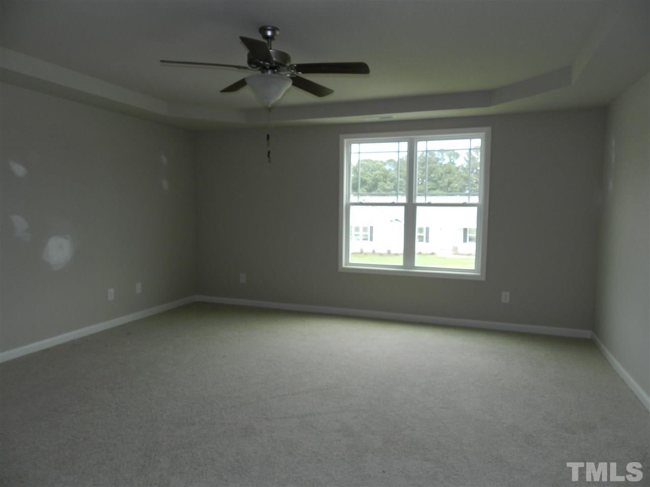 87 Willow Ridge Circle Willow Spring, NC 27592 - Photo 5 of 7 an empty room with a window