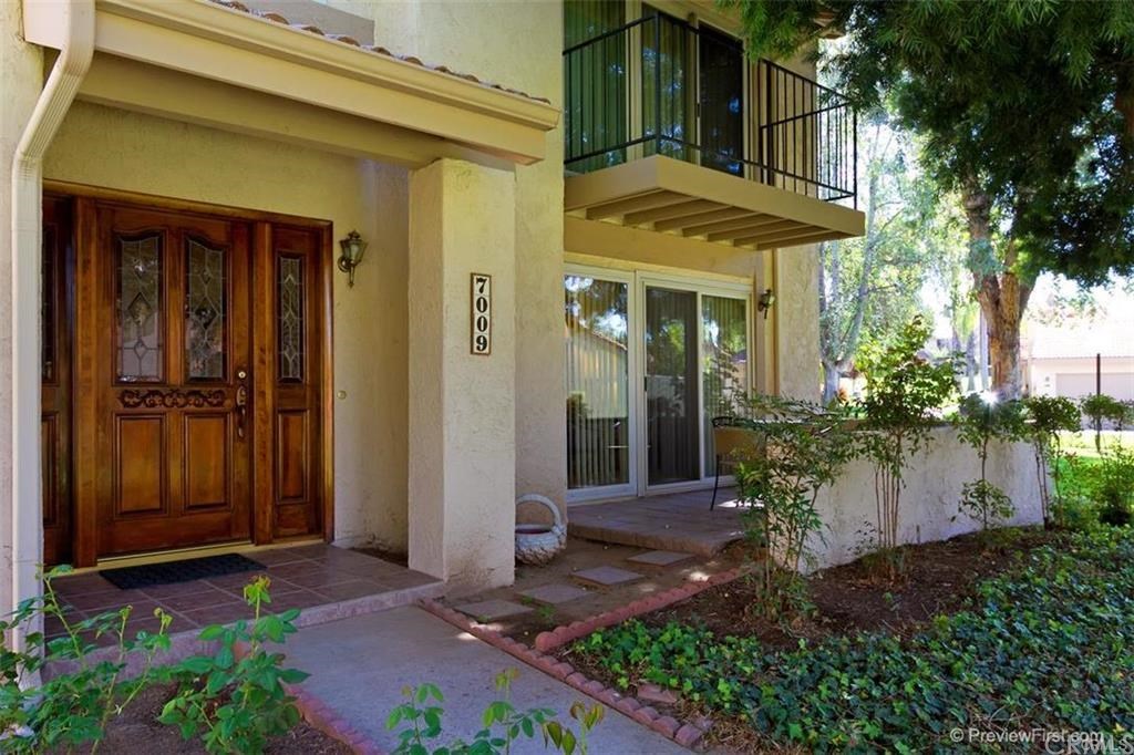 7009 Seville Way Riverside, CA 92504 - Photo 1 of 1 Front entry way showing porch and overhead balcony