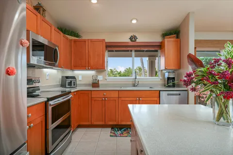 a view of an outdoor sitting area with couch and umbrella
