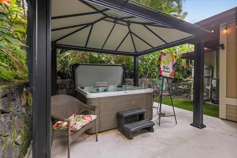 a view of a patio with table and chairs potted plants