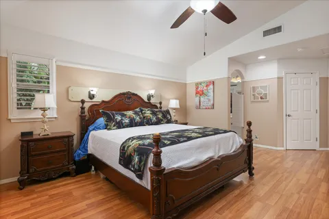 a spacious bathroom with a double vanity sink a mirror and shower