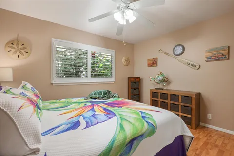 a bathroom with a granite countertop sink a mirror a shower and a bathtub