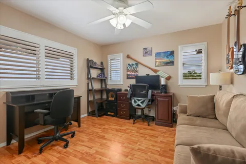 a living room with furniture a chandelier and a window
