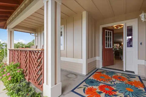 a view of a porch with a table and chairs
