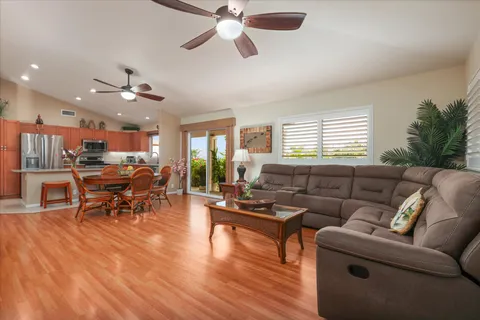 a dining room with furniture and wooden floor