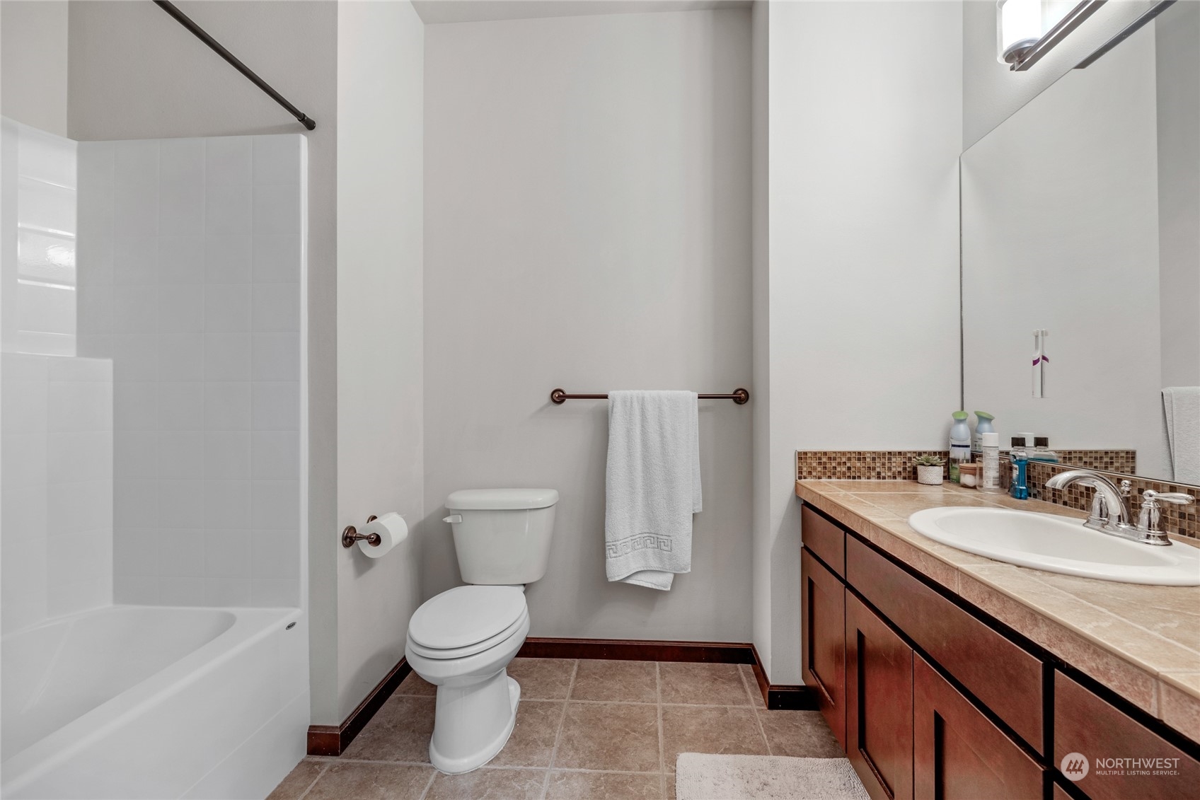 7521 Broadway Everett, WA 98203 - Photo 20 of 25 a bathroom with a sink a toilet and shower
