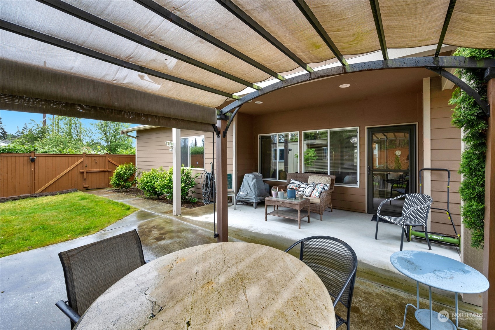 7521 Broadway Everett, WA 98203 - Photo 21 of 25 a view of a patio with table and chairs and potted plants