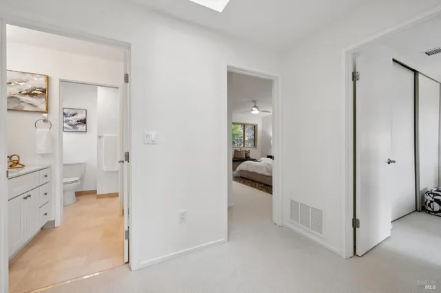a en suite bathroom with a tub shower and a sink
