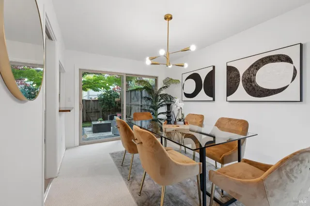 a dining room with furniture and window