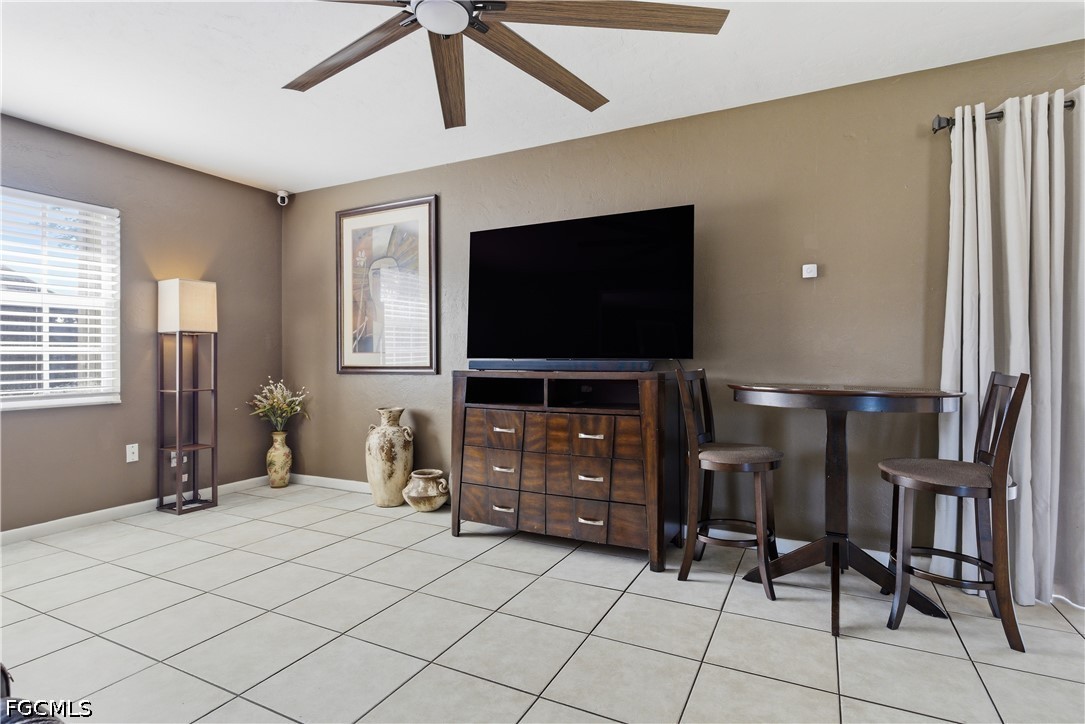 4960 20th Place Southwest Naples, FL 34116 - Photo 8 of 33 a living room with furniture and a flat screen tv