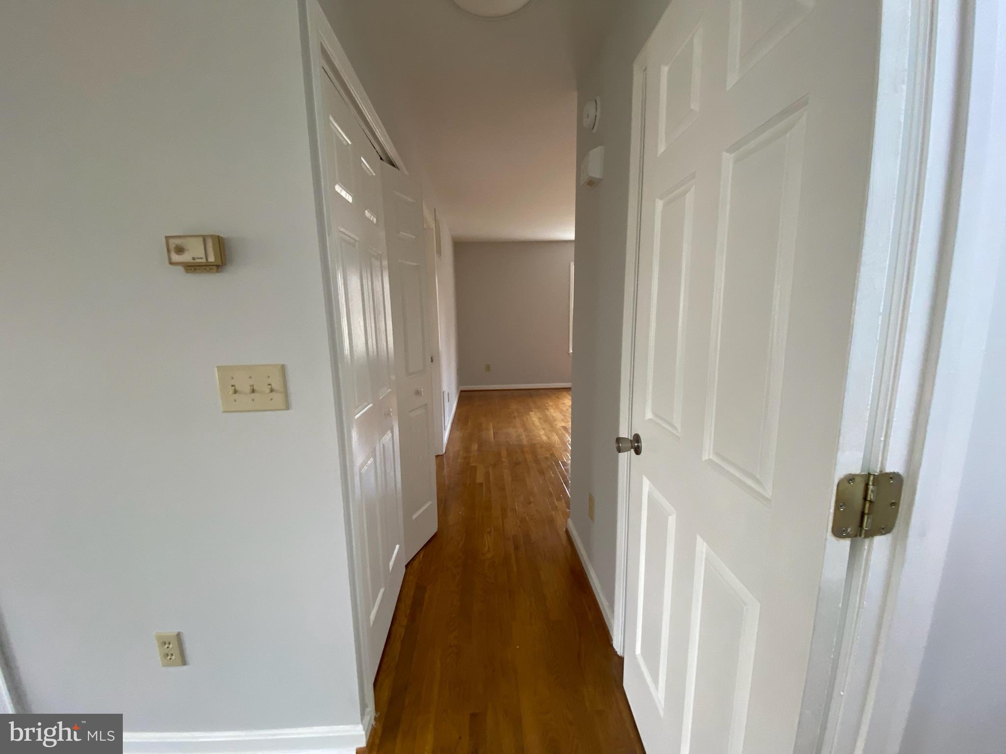 321 Spring Street Culpeper, VA 22701 - Photo 9 of 50 Hall way to living room and primary bedroom