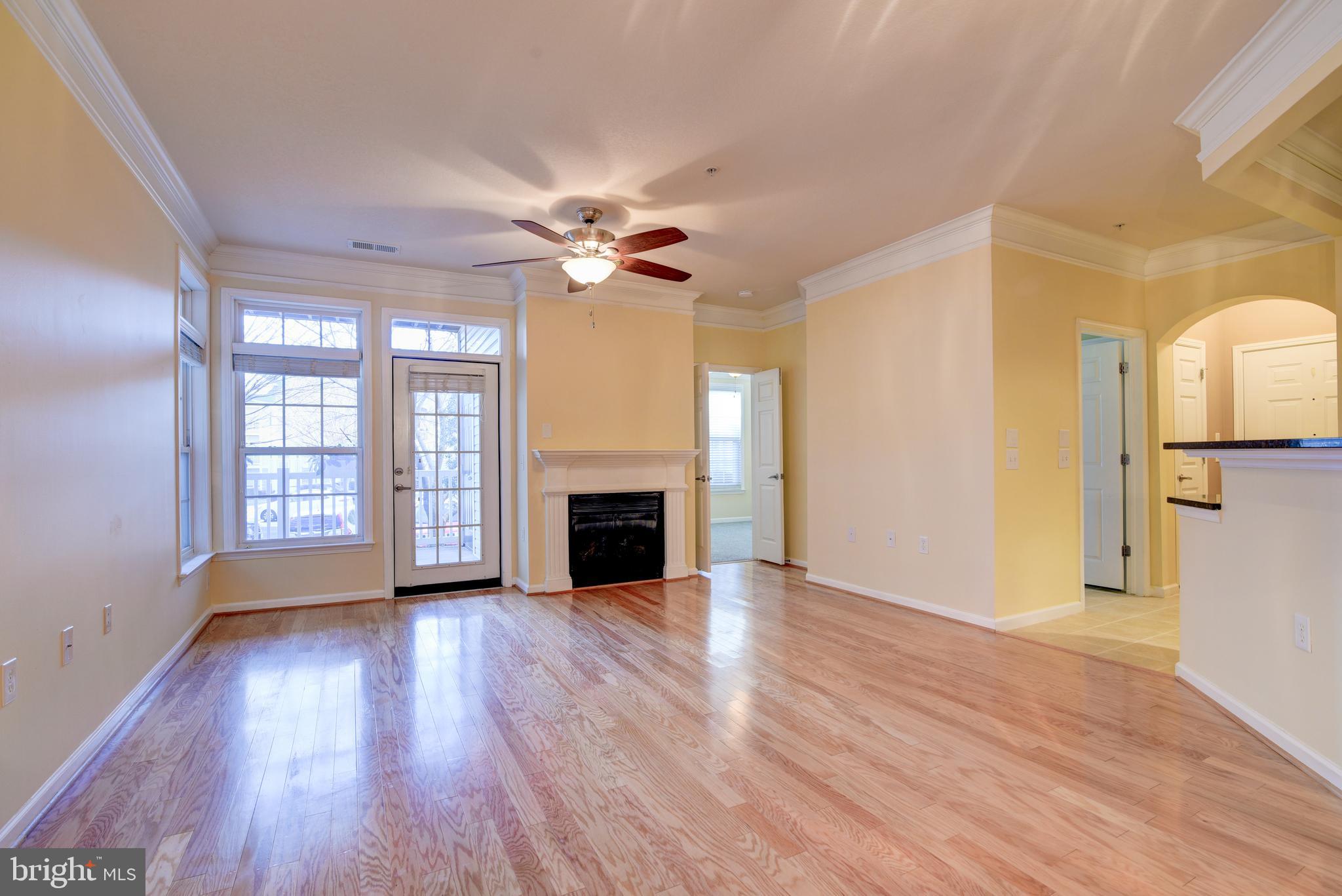 GLEAMING WOOD FLOORS & GAS FIREPLACE
