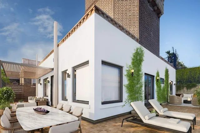 a view of a balcony with chairs and wooden floor