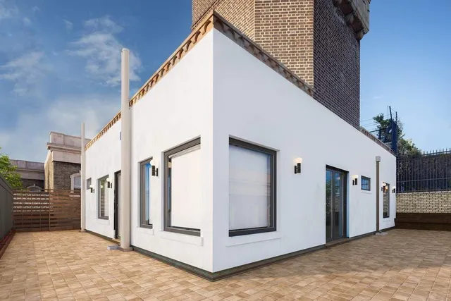 a view of a balcony with wooden floor