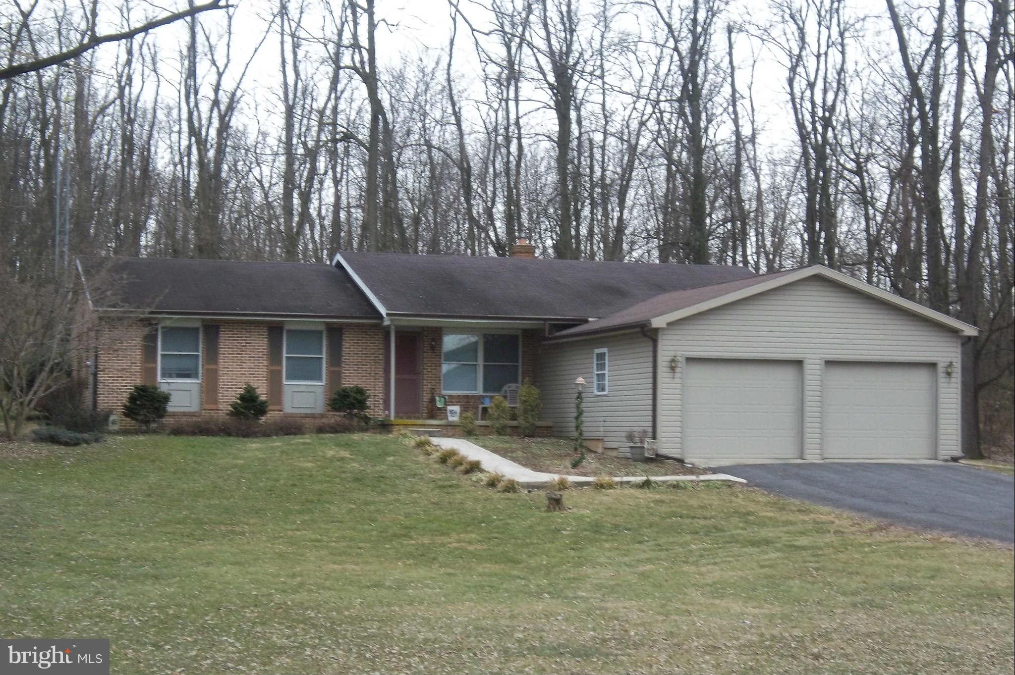 7749 Talhelm Road Chambersburg, PA 17202 - Photo 1 of 26 a view of a house with a backyard and a tree